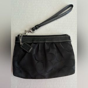 Coach wristlet. Black with red lining.
